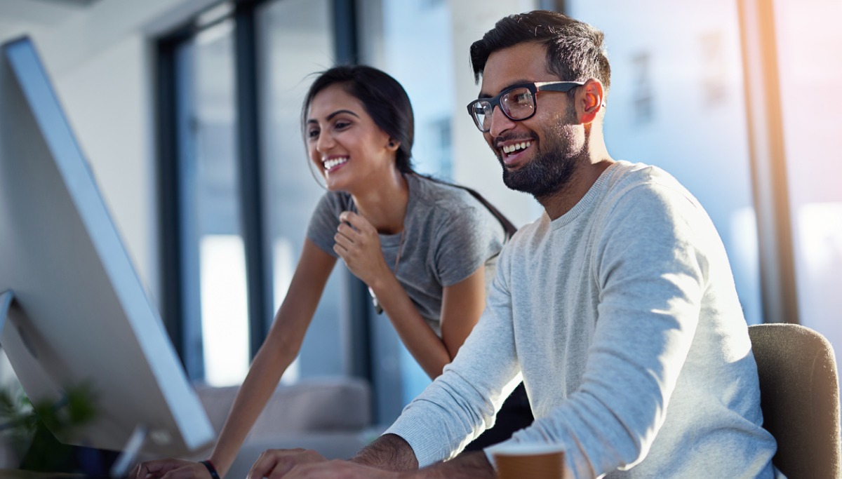 Couple looking at computer screen together