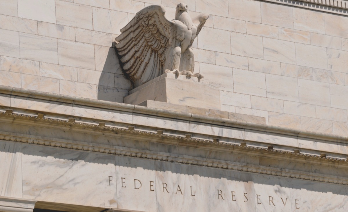 Close-up of eagle statue near the top of the Federal Reserve's facade